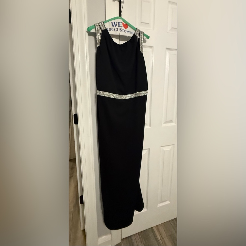 Stunning maxi dress adorned with elegant silver trimming.